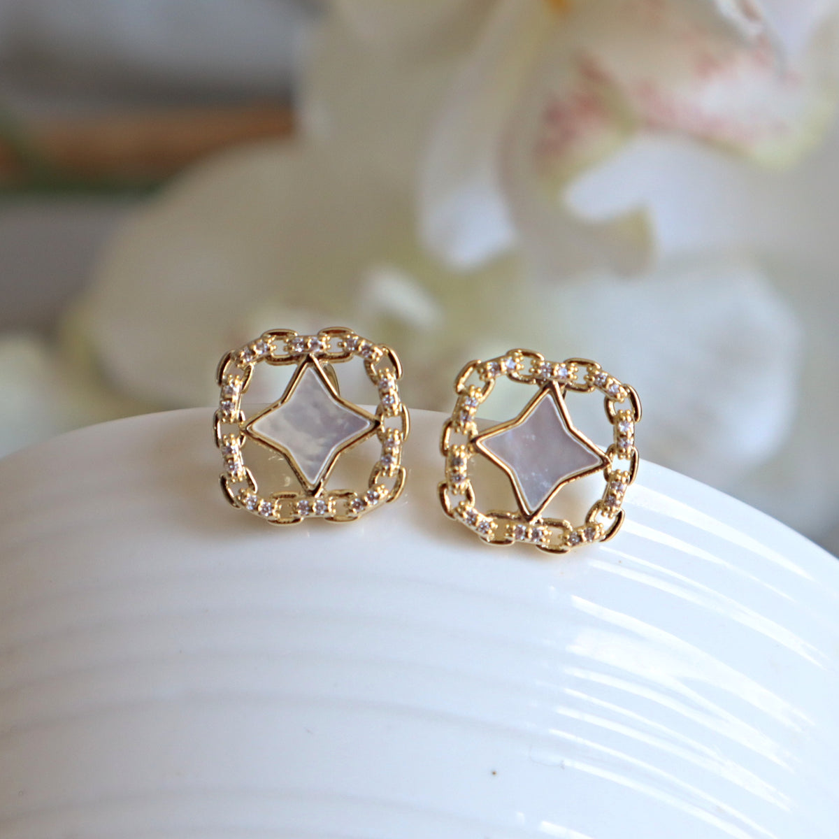 four point star clip on earrings